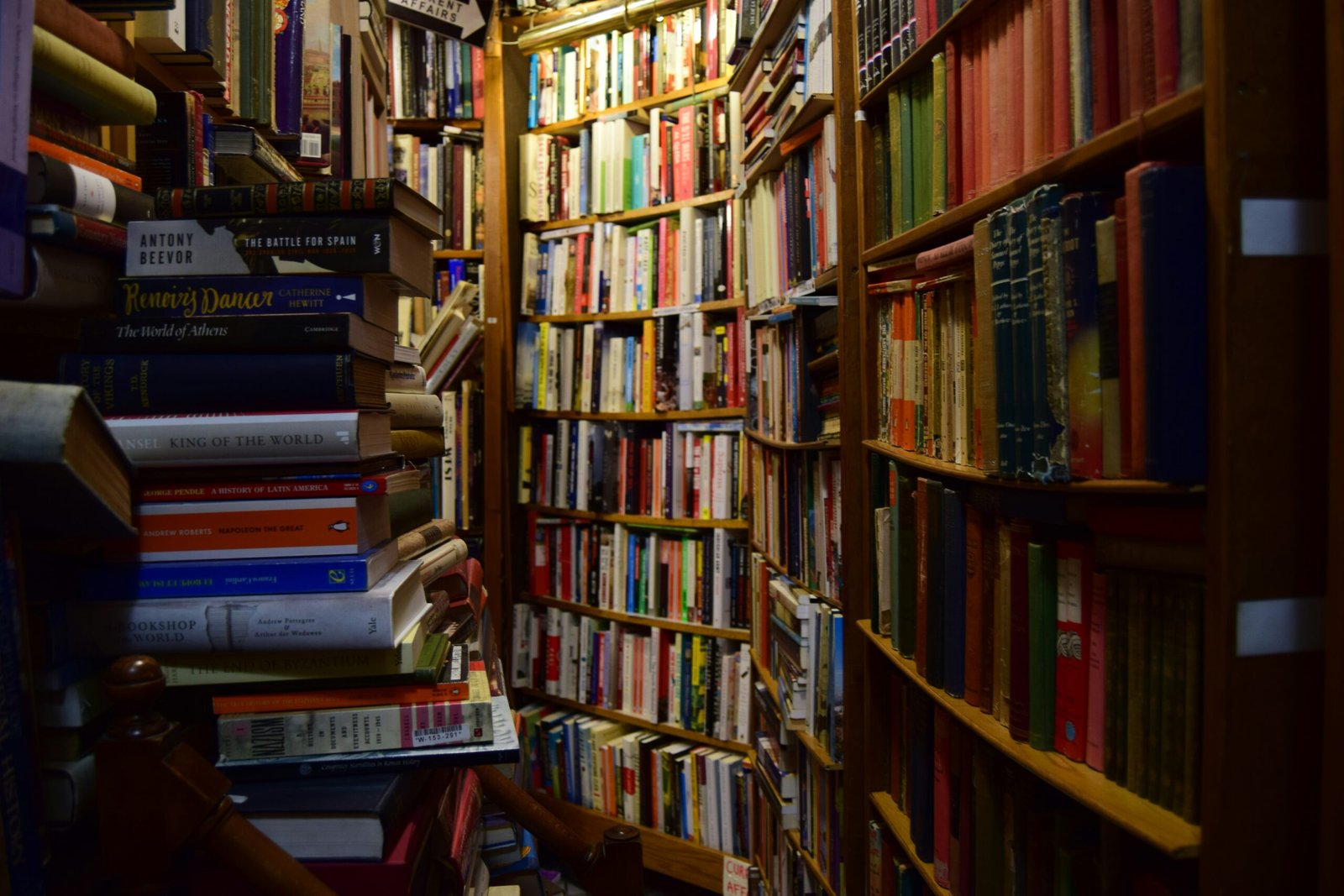 books on brown wooden shelf